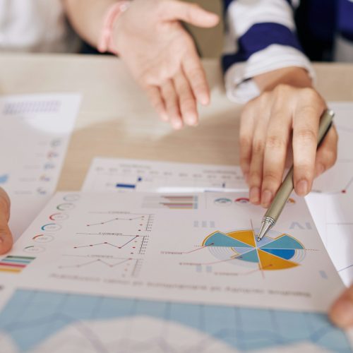 Financial experts analyzing report Financial experts analyzing report